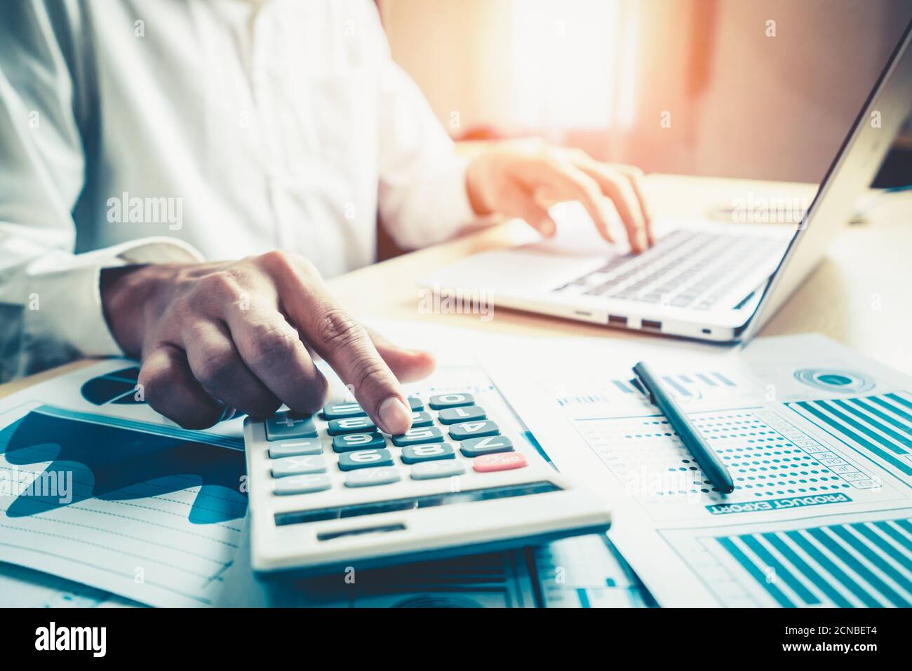 Businessman accountant or financial expert analyze business report graph and finance chart at corporate office. Concept of finance economy, banking Stock Photo