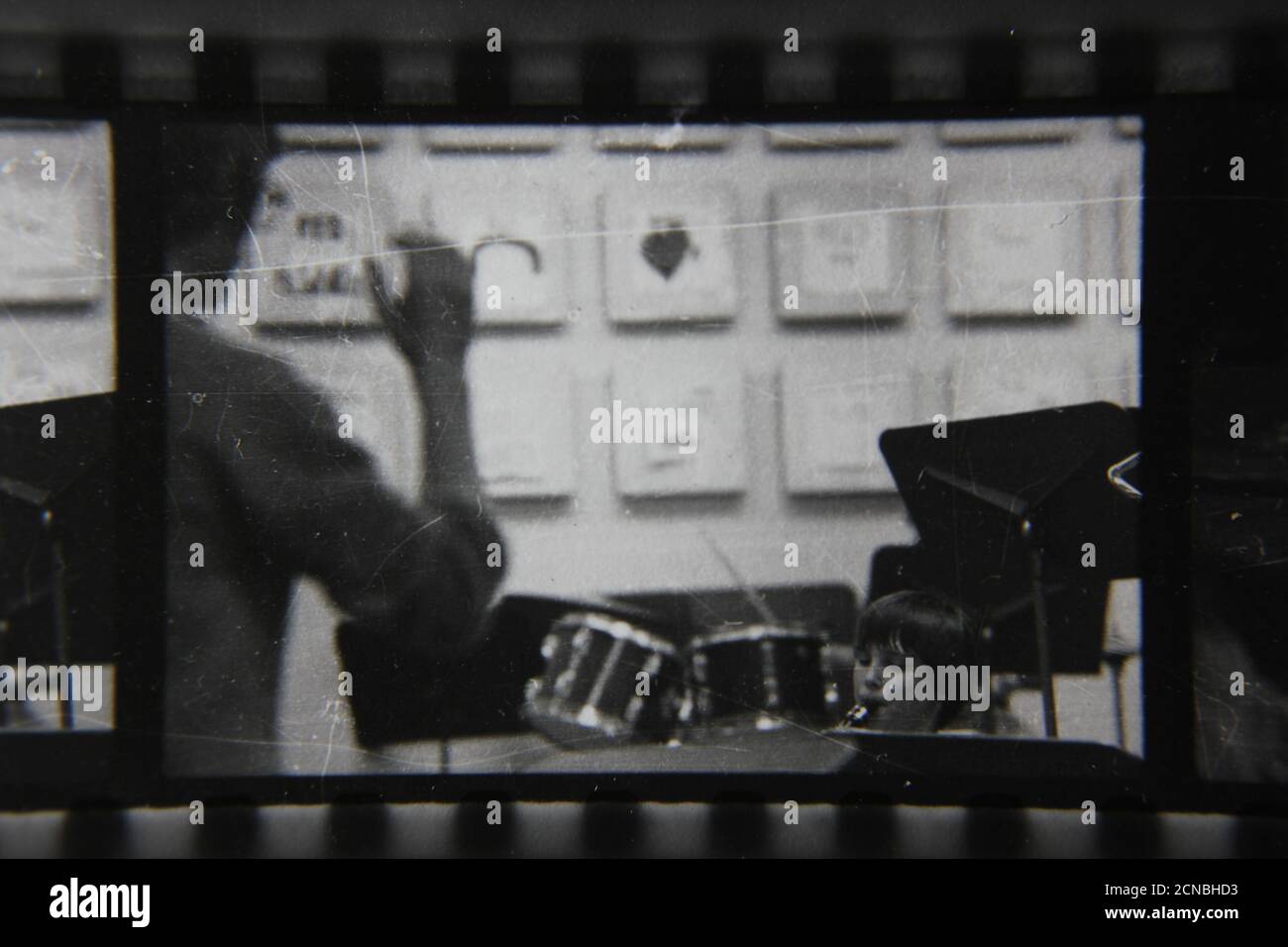 Fine 1970s vintage black and white photography of a man conducting a school band. Stock Photo
