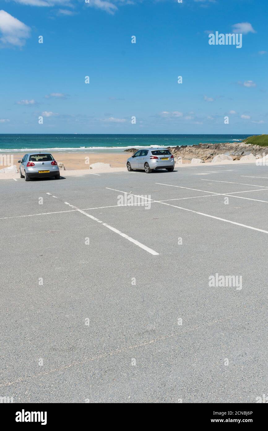 A normally very busy carpark at Fistral is now virtually empty due to the Coronavirus Covid 19 pandemic in Newquay in Cornwall. Stock Photo