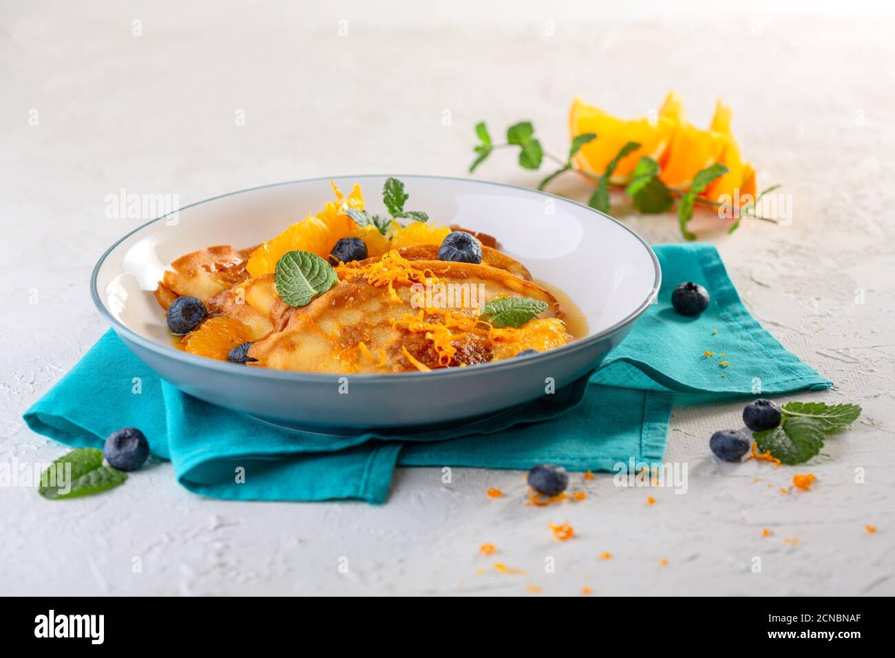 Thin French crepes with orange sauce Stock Photo Alamy