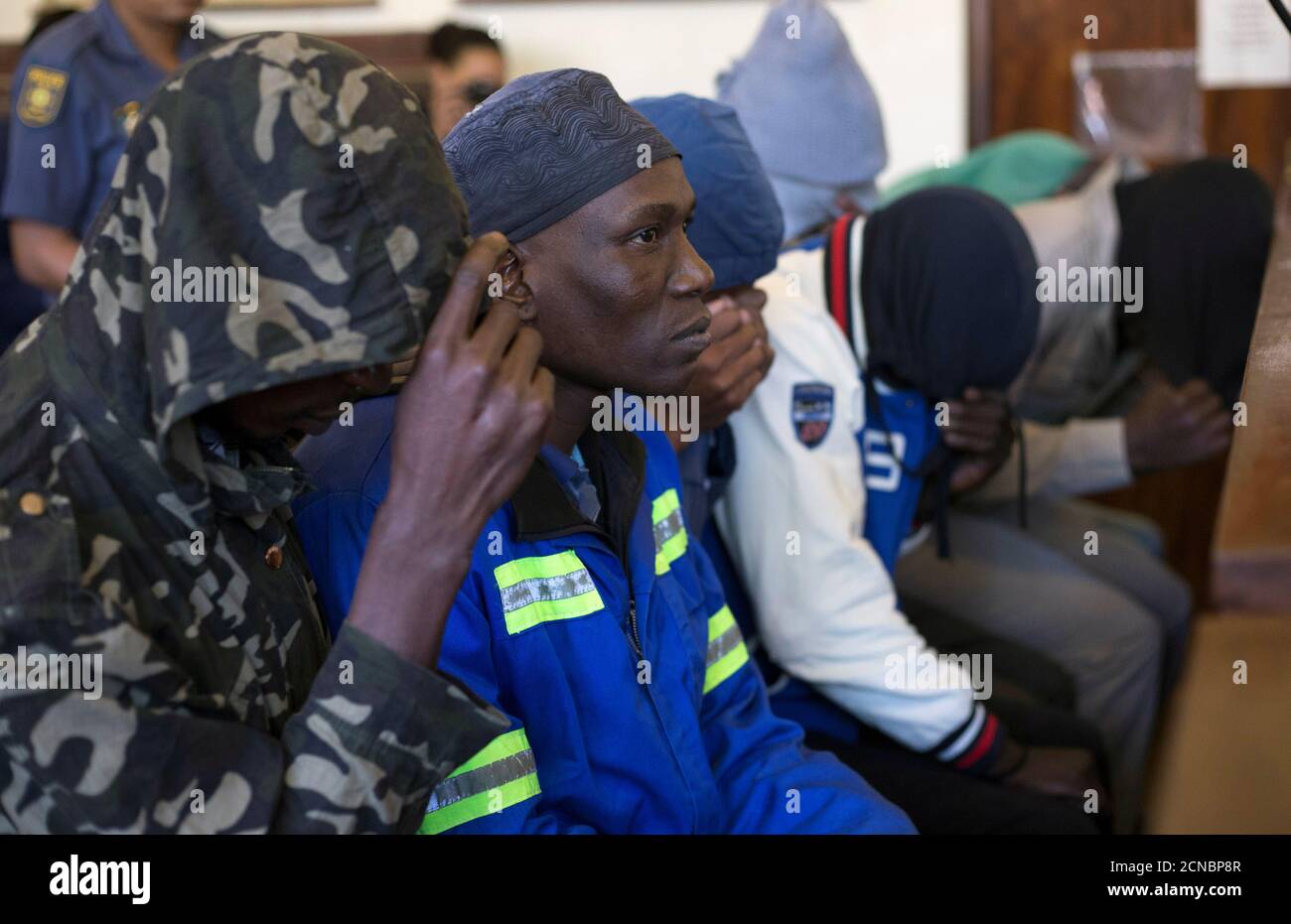 Men Accused Of Cannibalism Sit In The Dock Where They Face Charges Of 