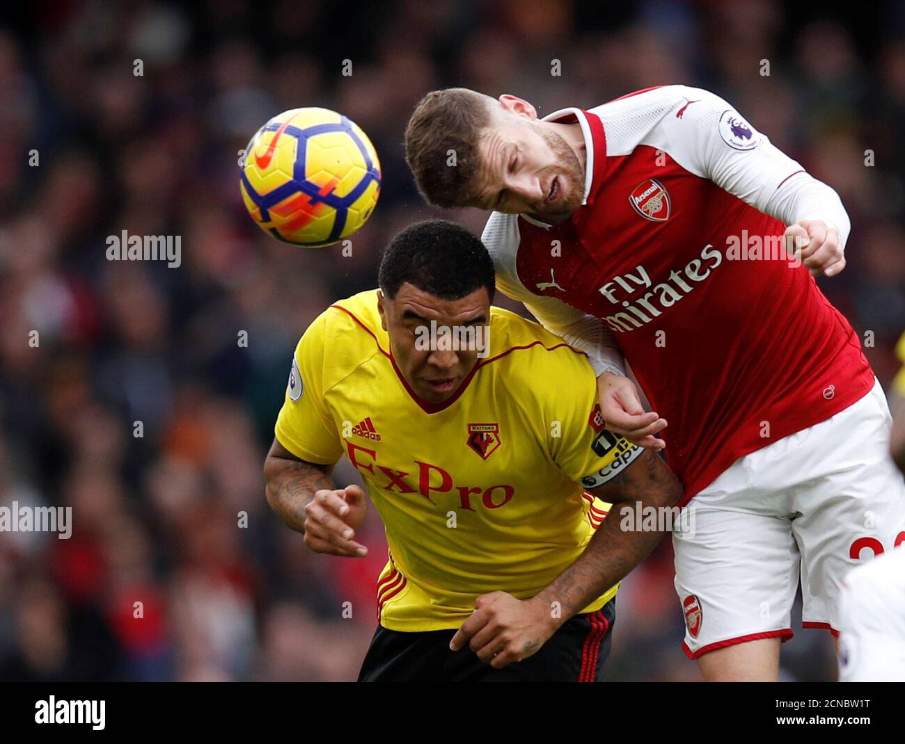 Soccer Football - Premier League - Arsenal vs Watford - Emirates Stadium, London, Britain - March 11, 2018   Watford's Troy Deeney in action with Arsenal's Shkodran Mustafi             REUTERS/Eddie Keogh    EDITORIAL USE ONLY. No use with unauthorized audio, video, data, fixture lists, club/league logos or 'live' services. Online in-match use limited to 75 images, no video emulation. No use in betting, games or single club/league/player publications.  Please contact your account representative for further details. Stock Photo