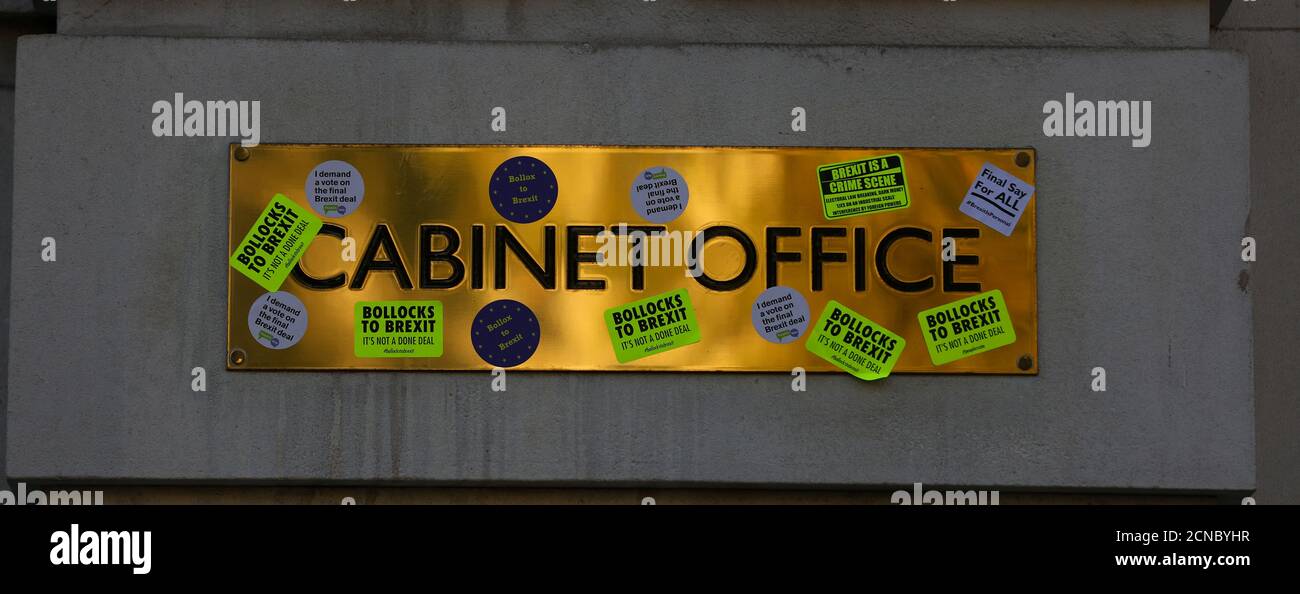 Stickers are seen stuck onto the Cabinet Office name-plate during an anti-Brexit demonstration march through central London, Britain October 20, 2018. REUTERS/Simon Dawson Stock Photo