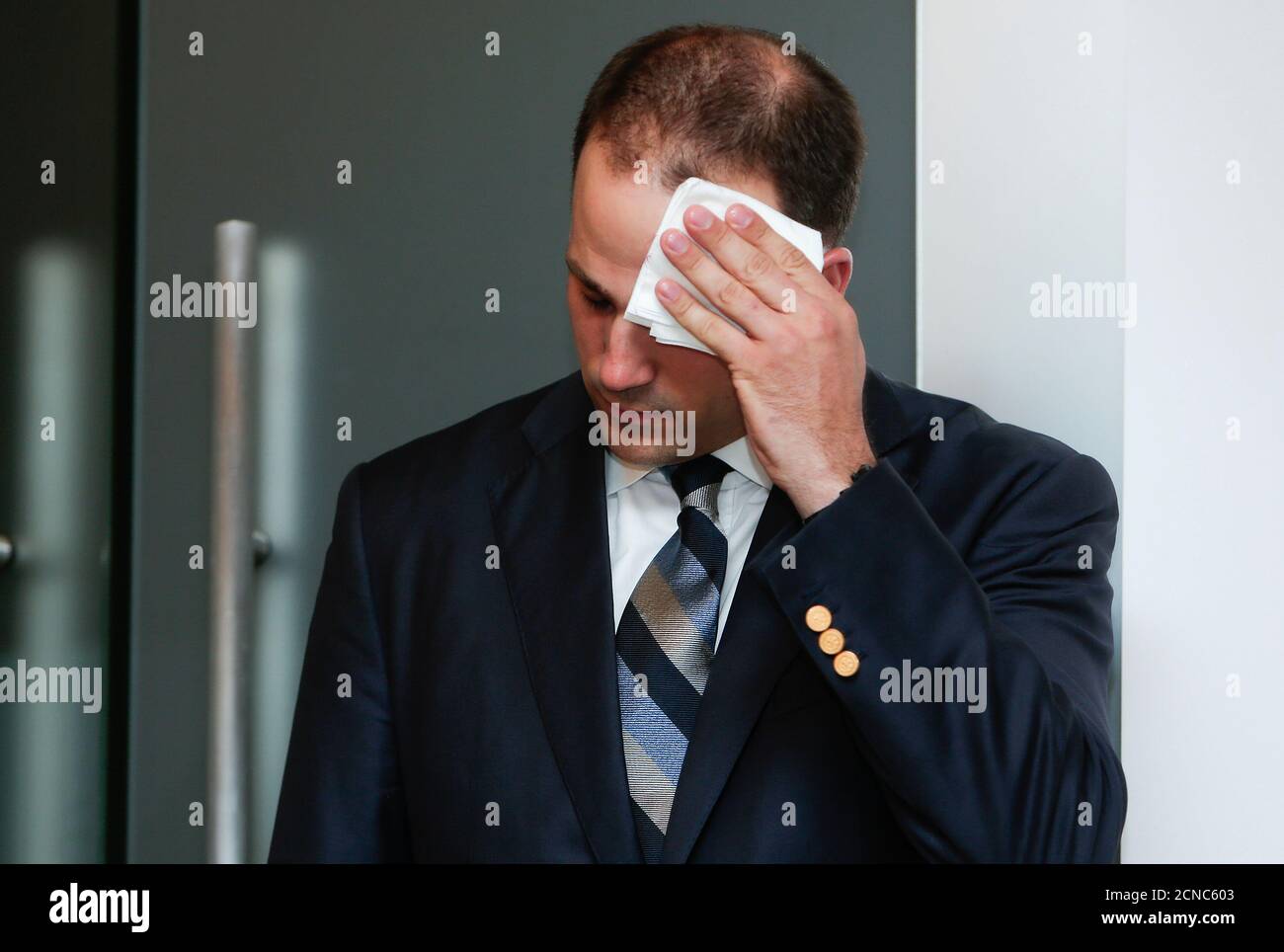 Michael Kobold, spokesperson of Gandolfini family, wipes his forehead during a news conference about James Gandolfini's death in Rome June 20, 2013. Gandolfini, the burly actor best known for his Emmy-winning portrayal of a conflicted New Jersey mob boss in the groundbreaking TV series 'The Sopranos,' died on Wednesday vacationing in Italy. He was 51. REUTERS/Yara Nardi (ITALY - Tags: OBITUARY ENTERTAINMENT) Stock Photo