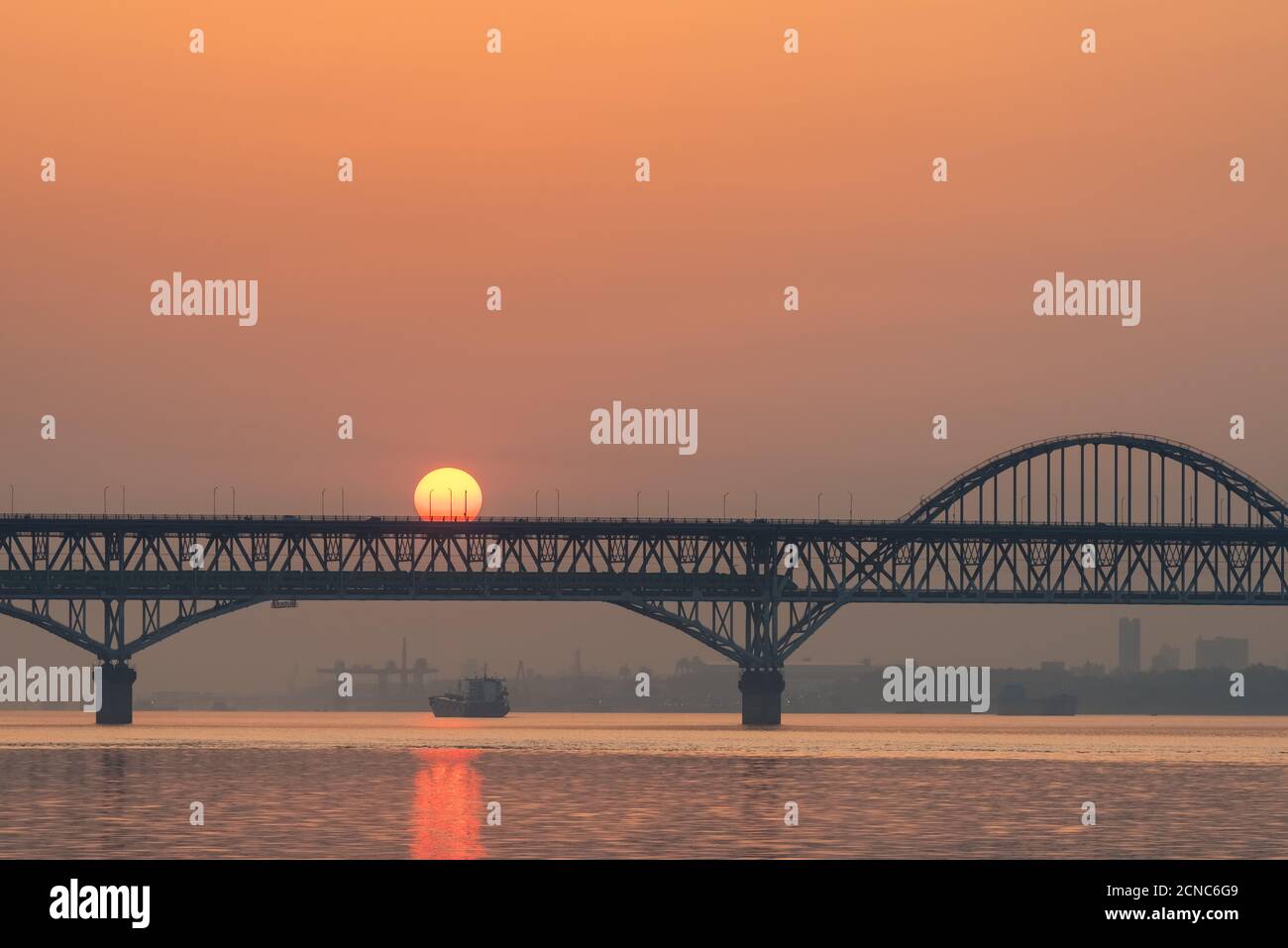 railway and highway combined bridge in sunrise Stock Photo
