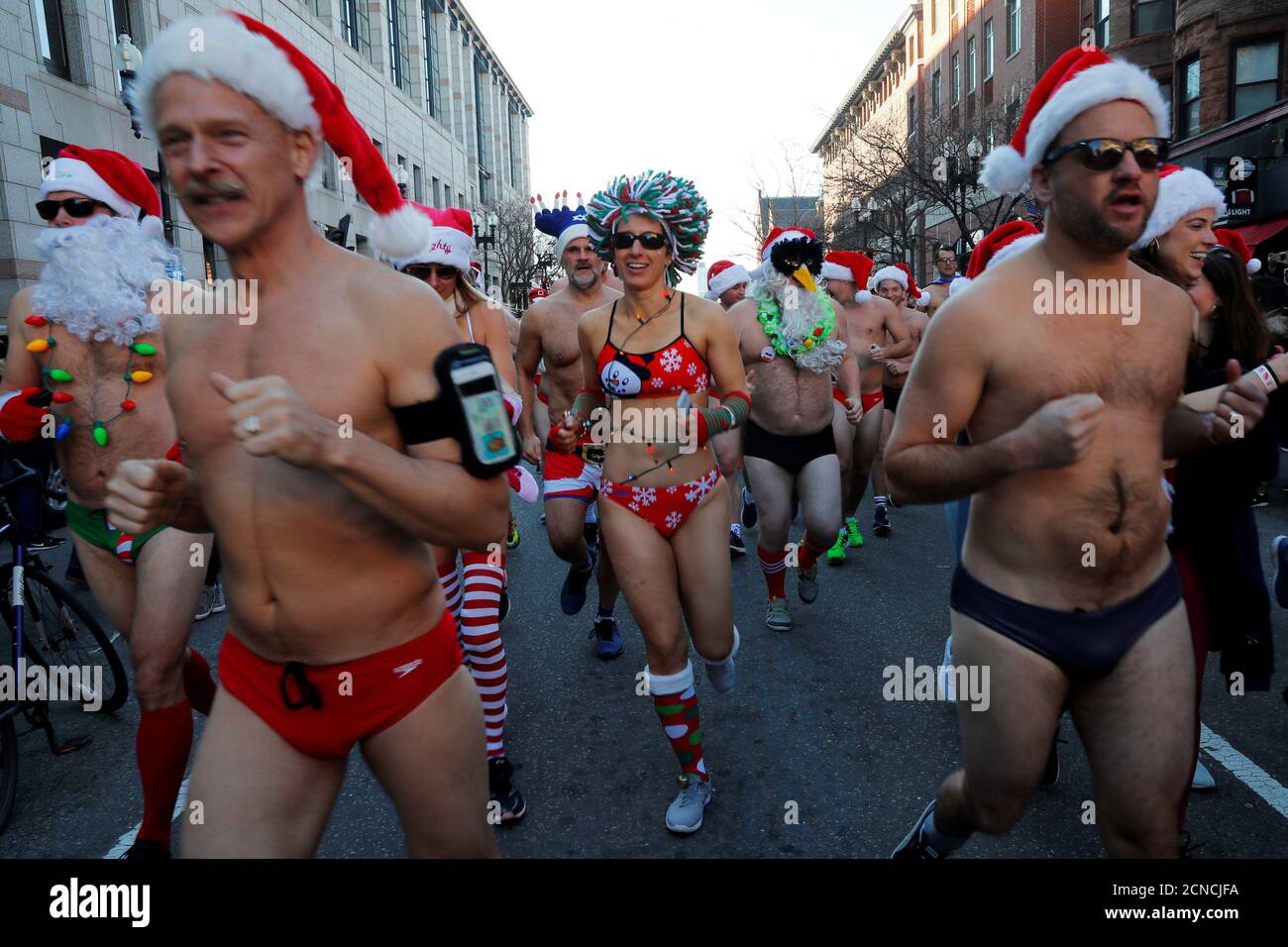 Participants leave the starting line for the annual Santa Speedo Run  through the Back Bay neighbourhood