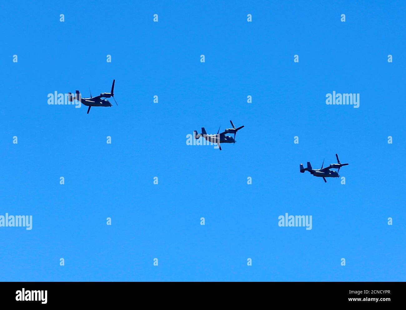 Three U.S. Marine MV-22 Osprey aircraft fly in formation as they transit near Marine Corps Air Station Miramar in San Diego, California, U.S. June 15, 2016.         REUTERS/Mike Blake Stock Photo