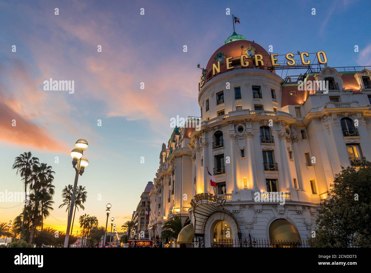 Illuminated Le Negresco Hotel building at sundown, Nice, Alpes Maritimes, Cote d'Azur, French Riviera, Provence, France, Mediterranean, Europe Stock Photo