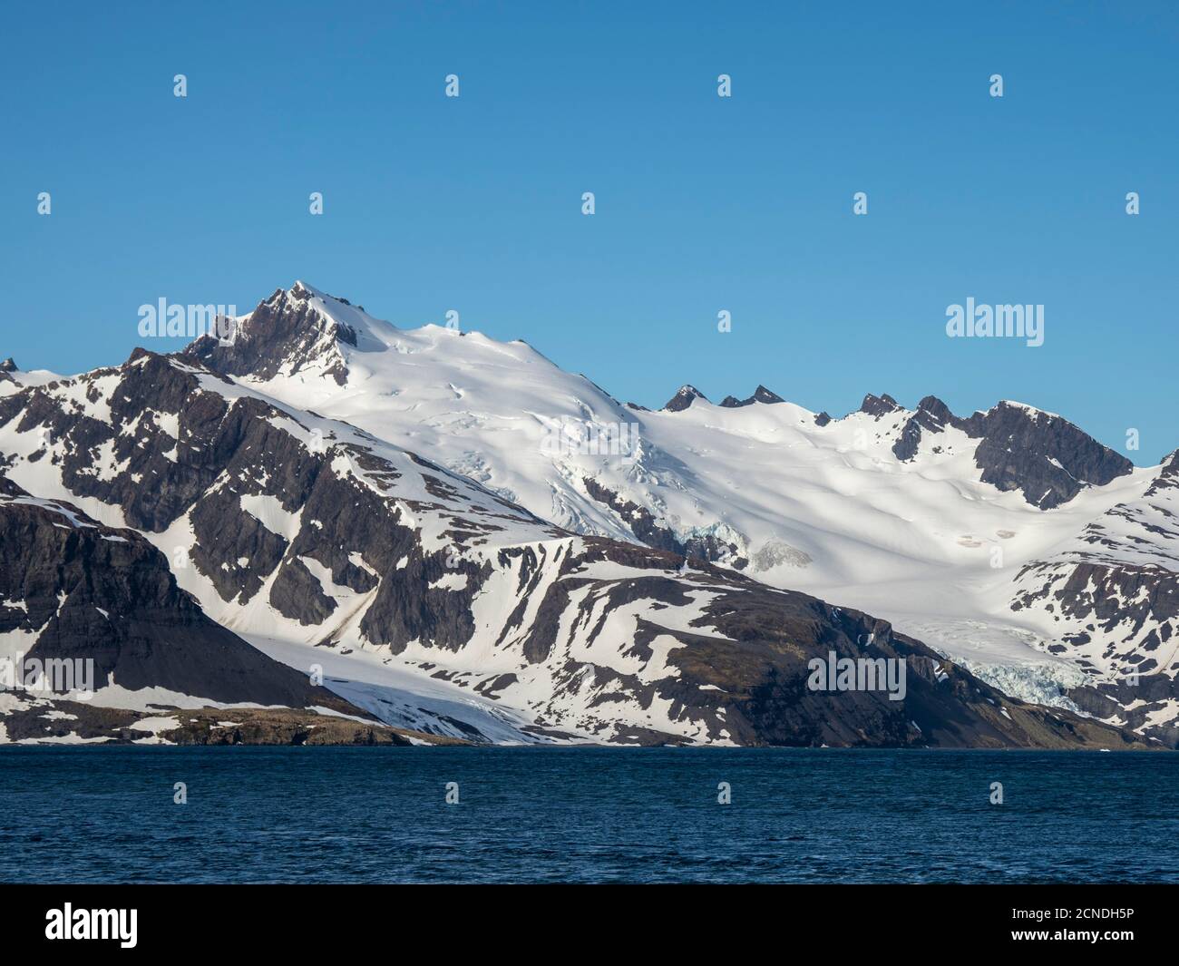 Snow-covered mountains in King Haakon Bay, South Georgia, Polar Regions Stock Photo