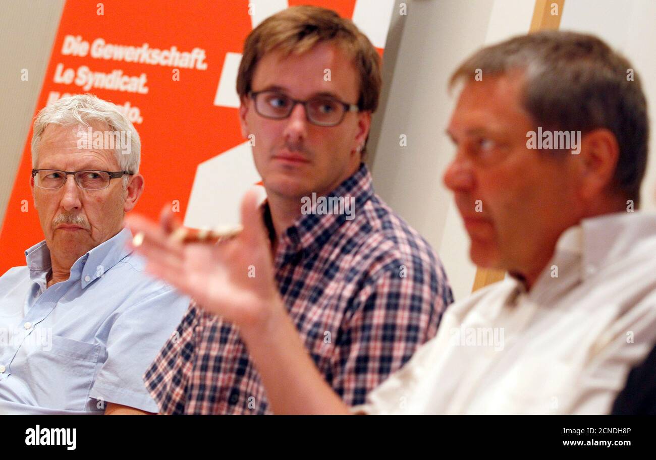 Members of Swiss inter-professional trade union UNIA Beda Moor (L to R), Serge Gnos and Patrick Kray, representative of Swissmetal workers attend a news conference on the situation in the Swissmetal plants in Dornach and Reconvilier Bern August 22, 2011. REUTERS/Pascal Lauener (SWITZERLAND - Tags: EMPLOYMENT BUSINESS POLITICS) Stock Photo