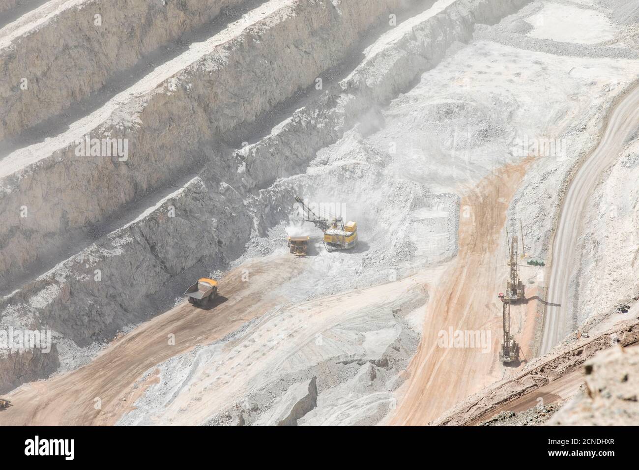 Huge machinery working the Chuquicamata open pit copper mine, the largest by volume in the world, Chile Stock Photo