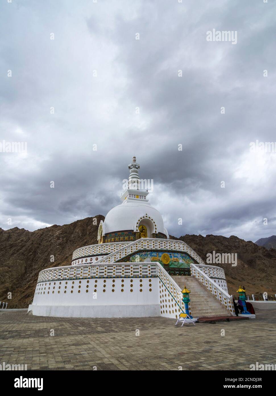 Shanti Palace and rain clouds, Ladakh, India. Holds relics of the Buddha at its base, enshrined by the 14th Dalai Lama. Stock Photo