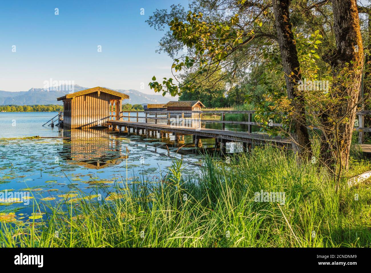 Boat houses on a jetty, Lake Chiemsee, Upper Bavaria, Germany, Europe Stock Photo