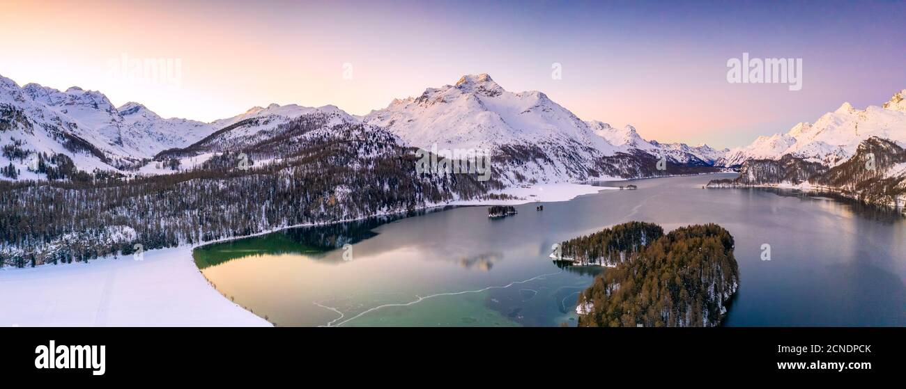 Aerial panoramic of Piz Da La Margna and Lake Sils during a winter sunrise, Engadine, canton of Graubunden, Switzerland, Europe Stock Photo