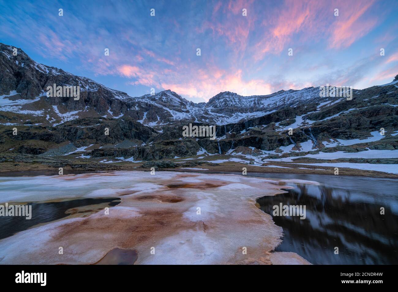 Melting ice during thaw at dawn, Alpe Fora, Valmalenco, Sondrio province, Valtellina, Lombardy, Italy, Europe Stock Photo