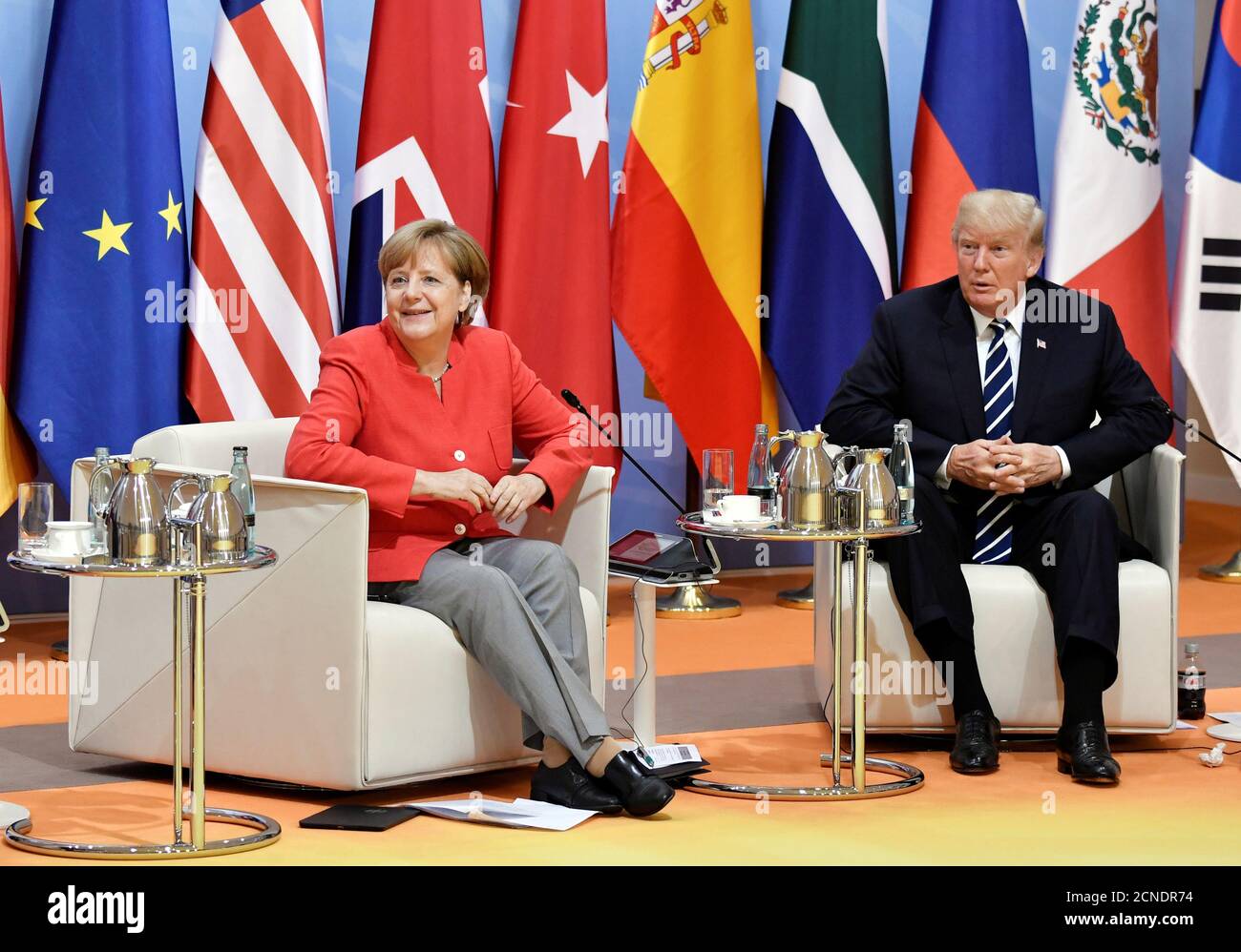 German Chancellor Angela Merkel and US President Donald Trump meet at the start of the 'retreat meeting' on the first day of the G20 summit in Hamburg, Germany, July 7, 2017. REUTERS/John MACDOUGALL,POOL Stock Photo