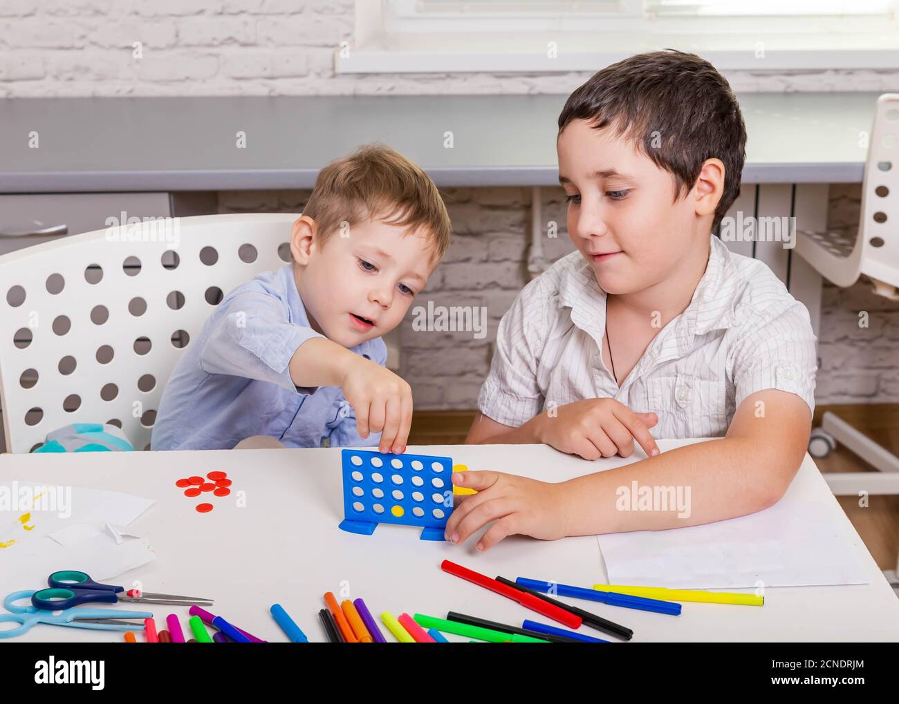 Two boys play board game hi-res stock photography and images - Alamy