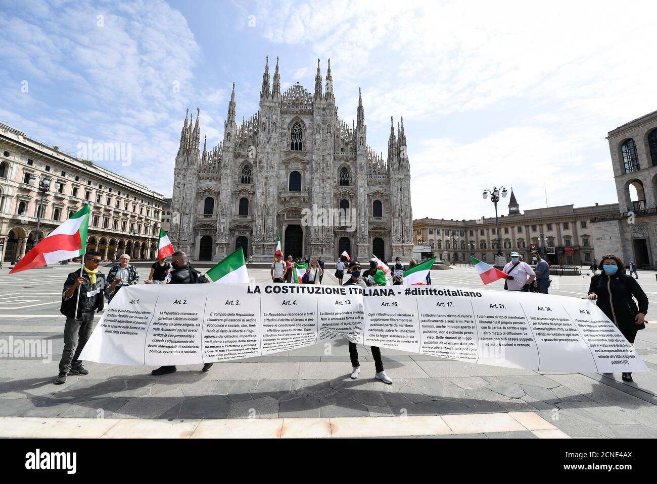 People wearing protective masks protest against the economic consequences of the lockdown at the Duomo square, as Italy begins a staged end to a nationwide lockdown due to a spread of the coronavirus disease (COVID-19), in Milan, Italy, May 4, 2020. REUTERS/Flavio Lo Scalzo Stock Photo