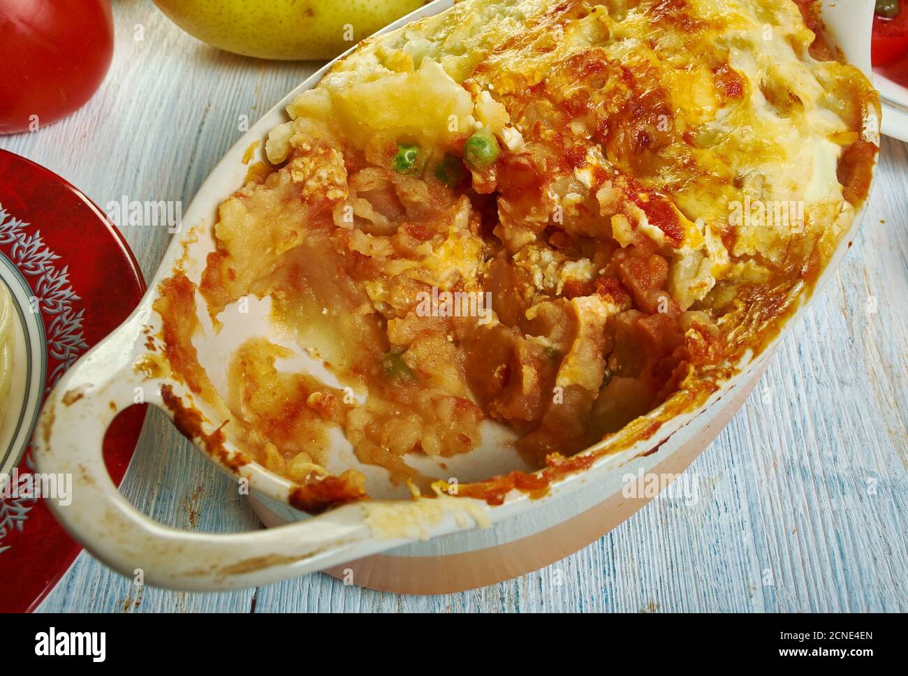 Gatto' di patate con ragu, potato with meat casserole, Sicilian cuisine, Traditional assorted Italy dishes, Top view. Stock Photo