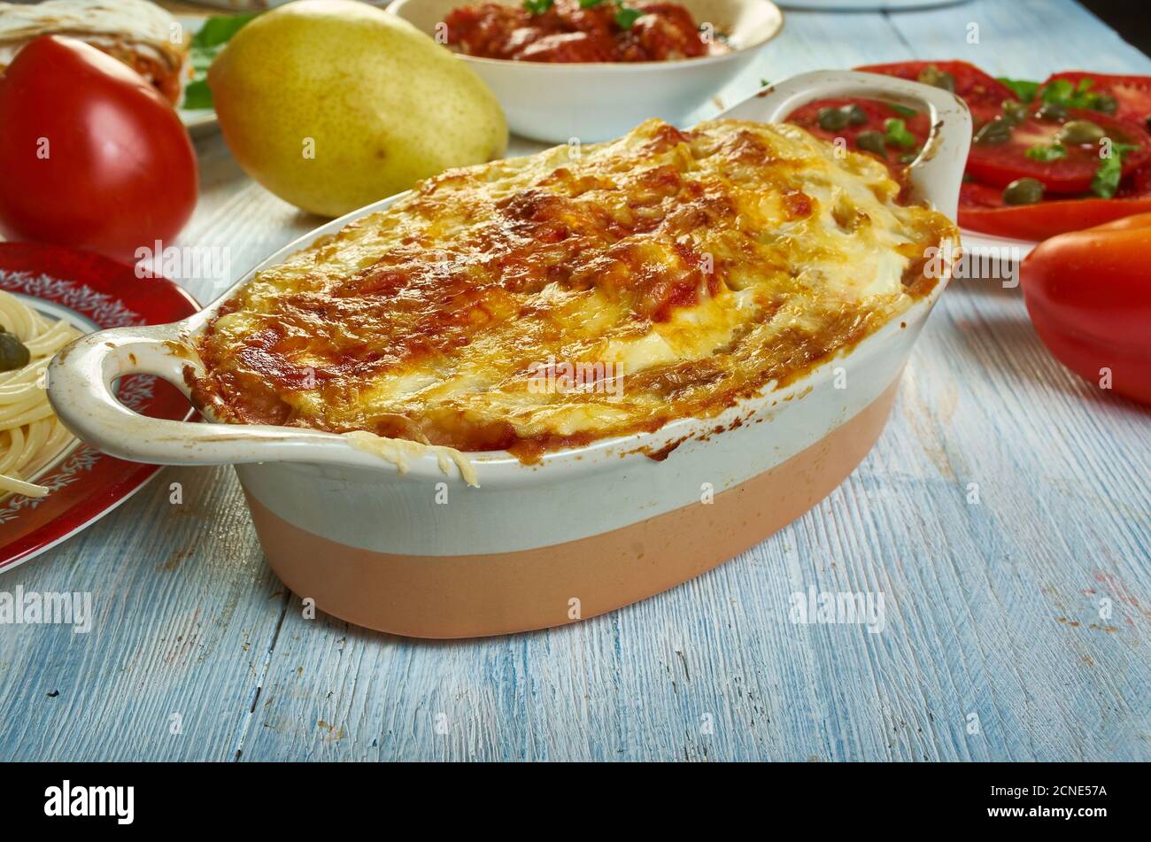 Gatto' di patate con ragu, potato with meat casserole, Sicilian cuisine, Traditional assorted Italy dishes, Top view. Stock Photo