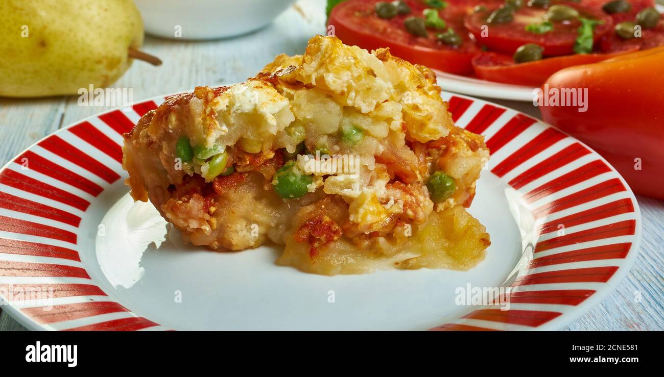 Gatto' di patate con ragu, potato with meat casserole, Sicilian cuisine, Traditional assorted Italy dishes, Top view. Stock Photo