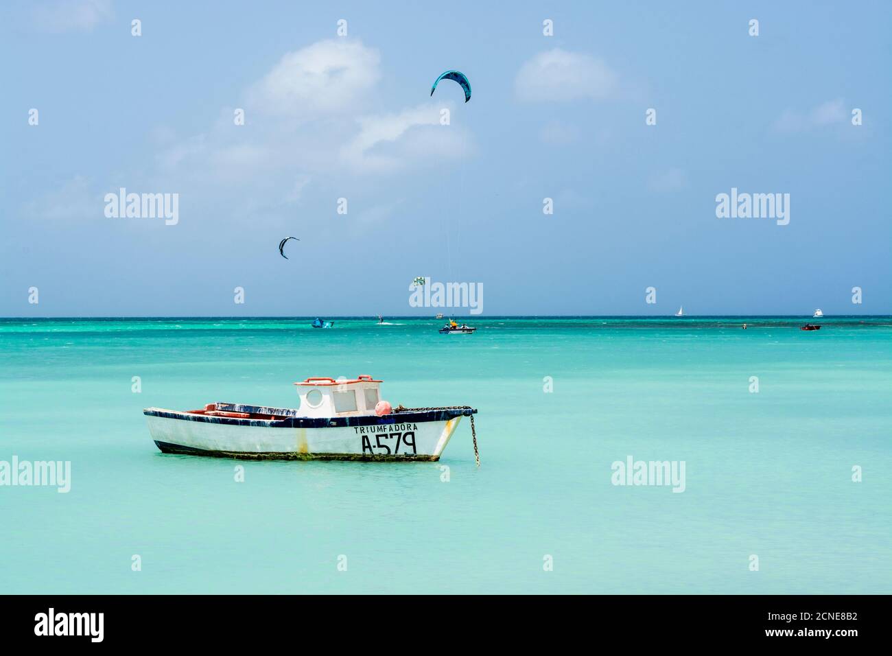 Fishing boat and windsurfing kitesurfing on Hadicurari Beach, Aruba, ABC Islands, Dutch Antilles, Caribbean, Central America Stock Photo