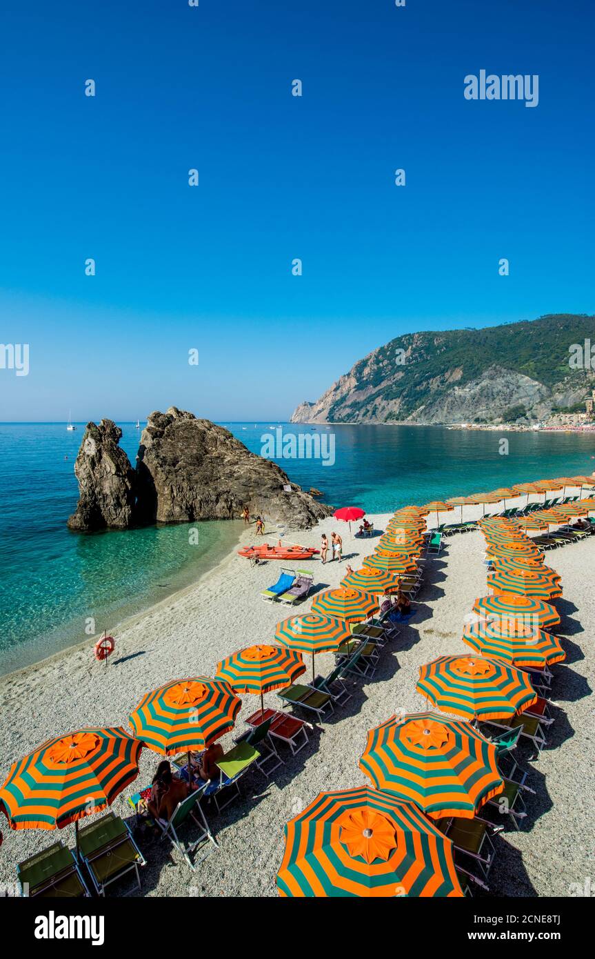 Beach umbrellas lining the beach in Monterosso al Mare, Cinque Terre, UNESCO World Heritage Site, Liguria, Italy, Europe Stock Photo