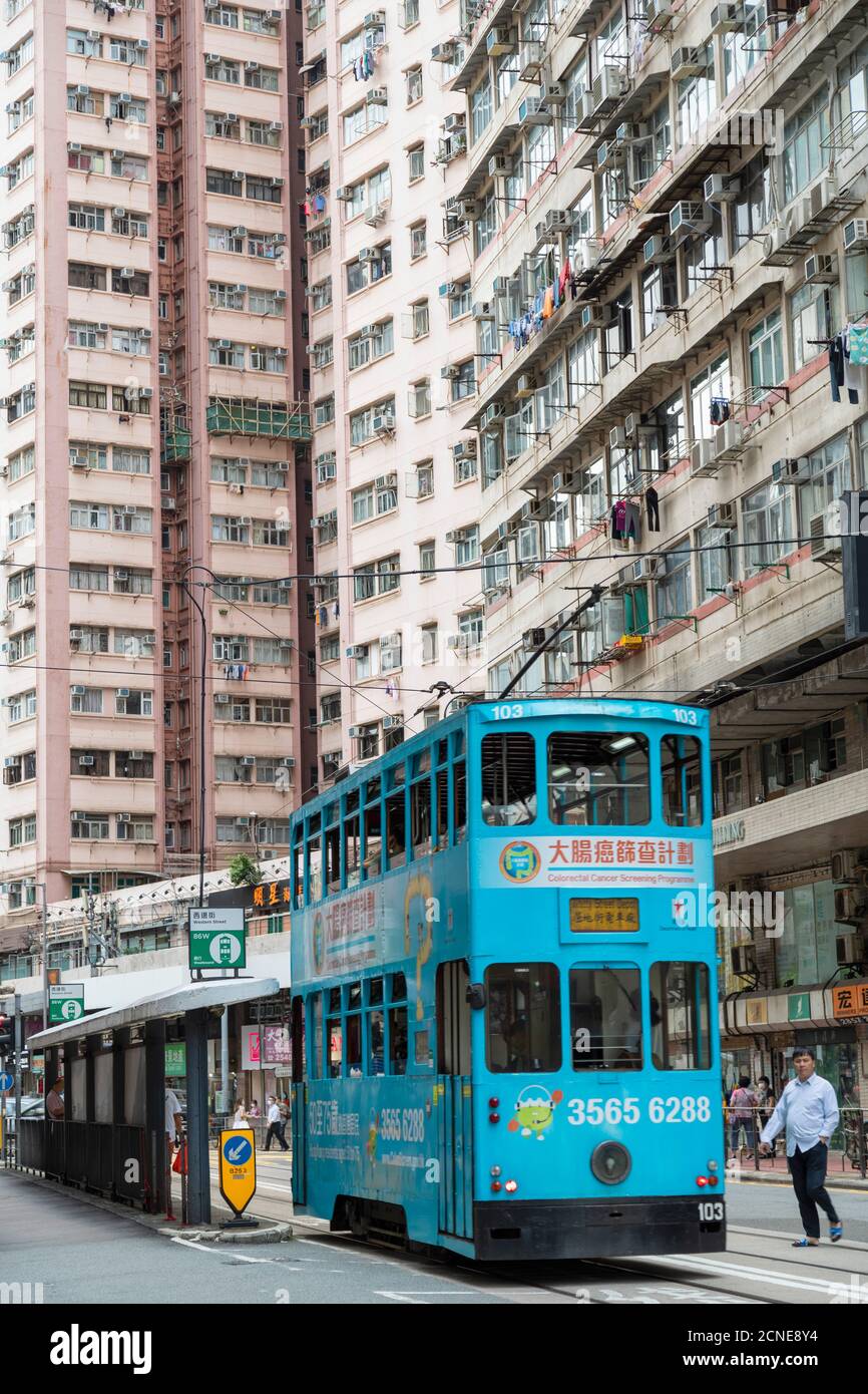 Trams at tram stop, Sai Ying Pun, Hong Kong Island, Hong Kong, China, Asia Stock Photo