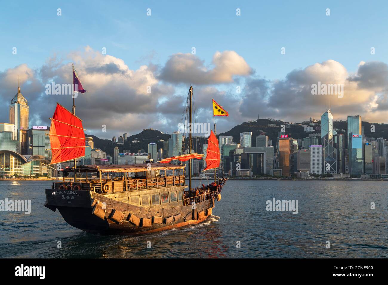 Junk boat and skyline of Hong Kong Island, Hong Kong, China, Asia Stock Photo