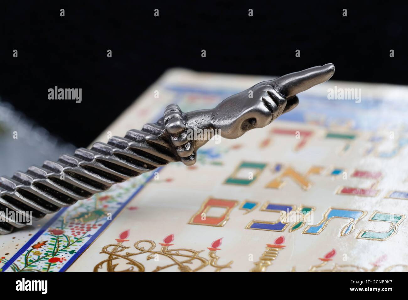 A silver Yad Jewish ritual pointer on a Torah, France, Europe Stock Photo