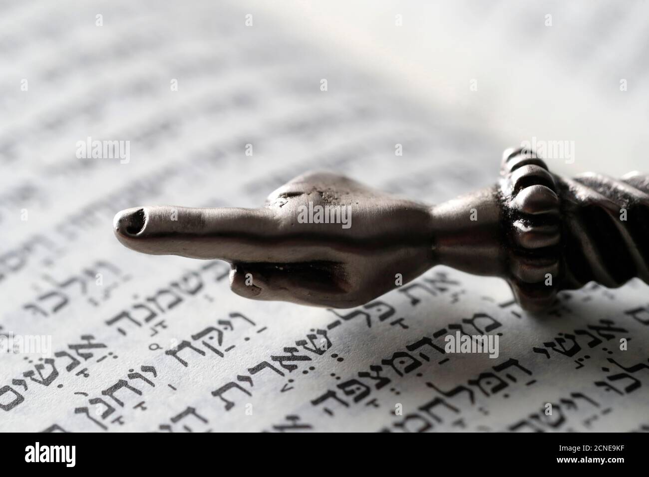 A silver Yad Jewish ritual pointer on a Torah, France, Europe Stock Photo