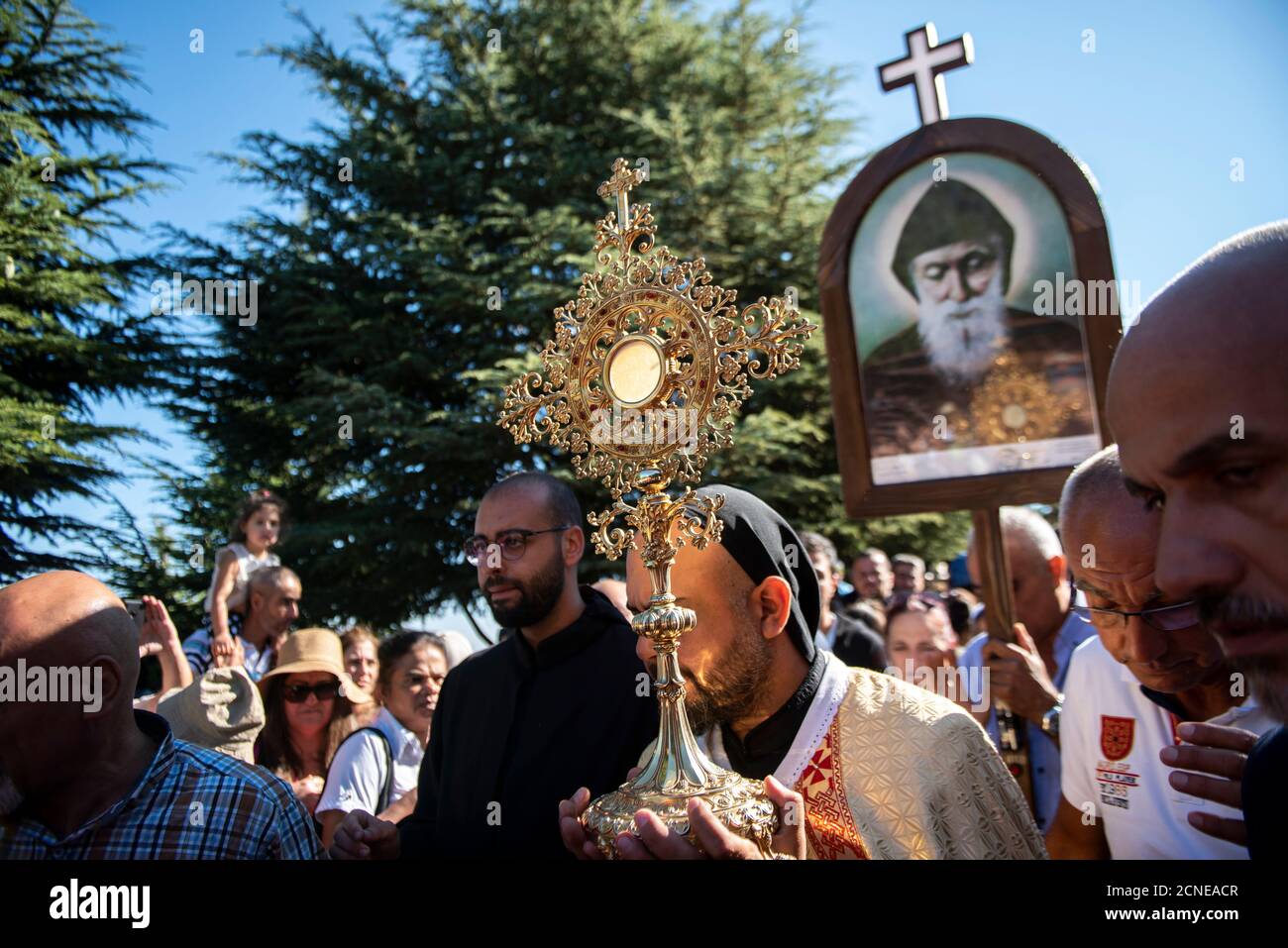 Lebanese Christians marching during a procession in the town of Annaya from the Hermitage to the Monastery of Saint Maroun, Annaya, Lebanon Stock Photo