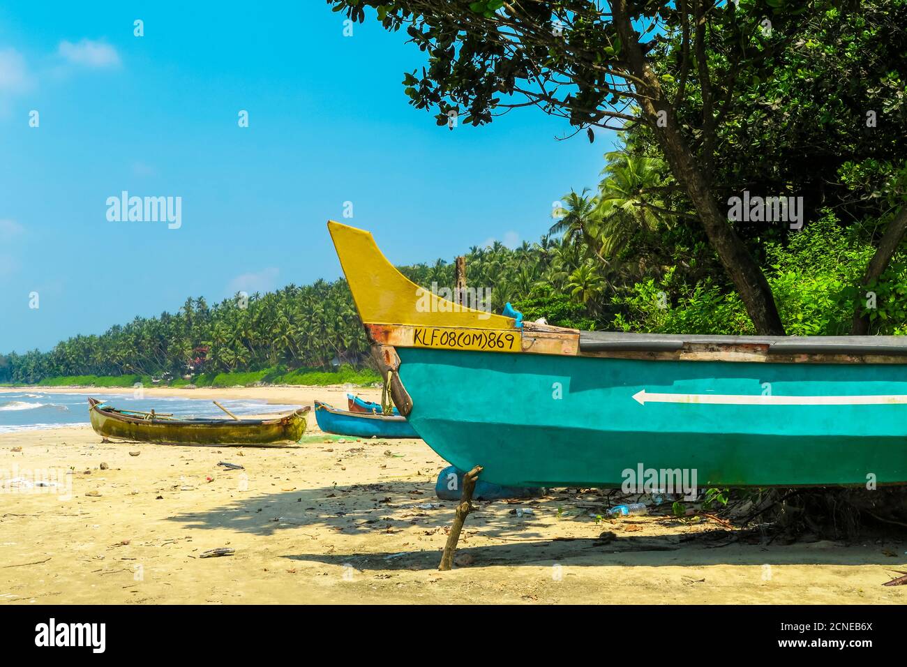 Fishing boats at lovely unspoilt, Kizhunna Beach, south of Kannur on the Keralan north coast,Kizhunna, Kannur, Kerala, India, Asia Stock Photo