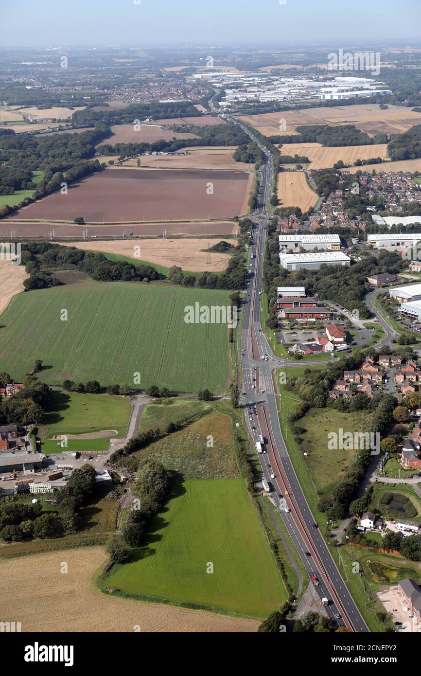 aerial view looking west along the East Lancashire Road (East Lancs Road) A580 at Lowton near Haydock, Warrington, Lancashire Stock Photo