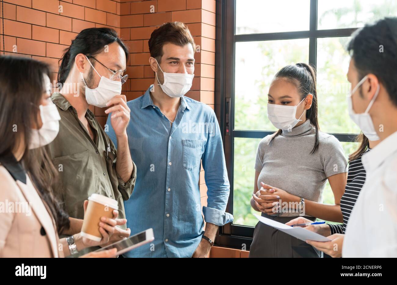 Businee person discussion meeting with face mask. Stock Photo