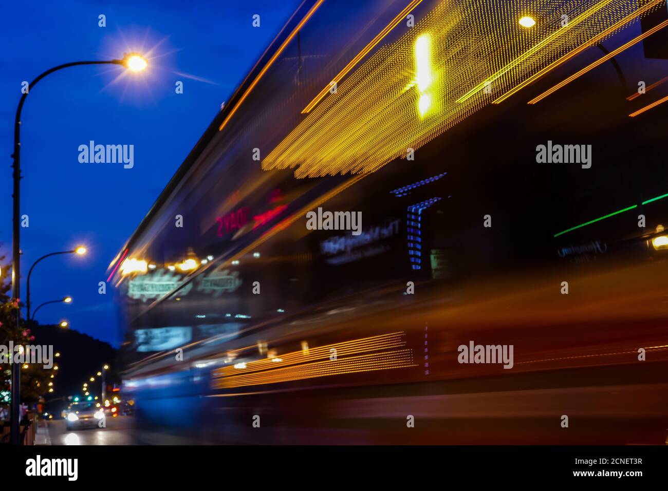 Bus motion with evenings street lights Stock Photo