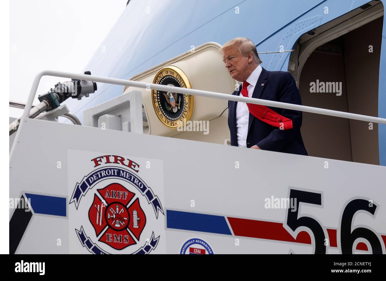 U.S. President Donald Trump steps off Air Force One at Detroit  International Airport prior to visiting the Ford Rawsonville Components  Plant during the coronavirus disease (COVID-19) pandemic as he arrives in  Detroit,