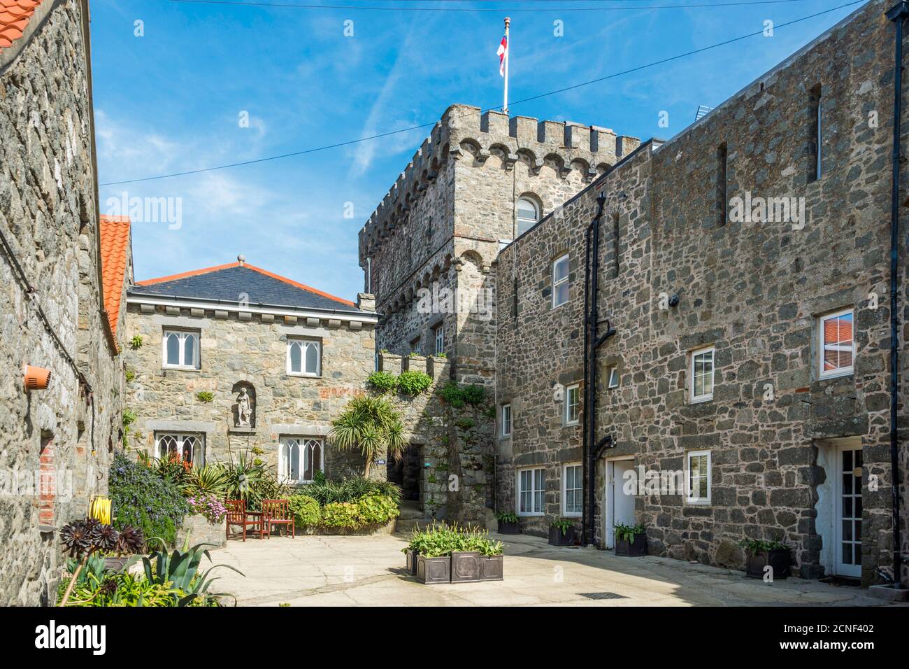 The Manor, on the Channel Island of Herm, part of the Bailiwick of Guernsey, UK.  The fortified keep has been converted into apartments. Stock Photo
