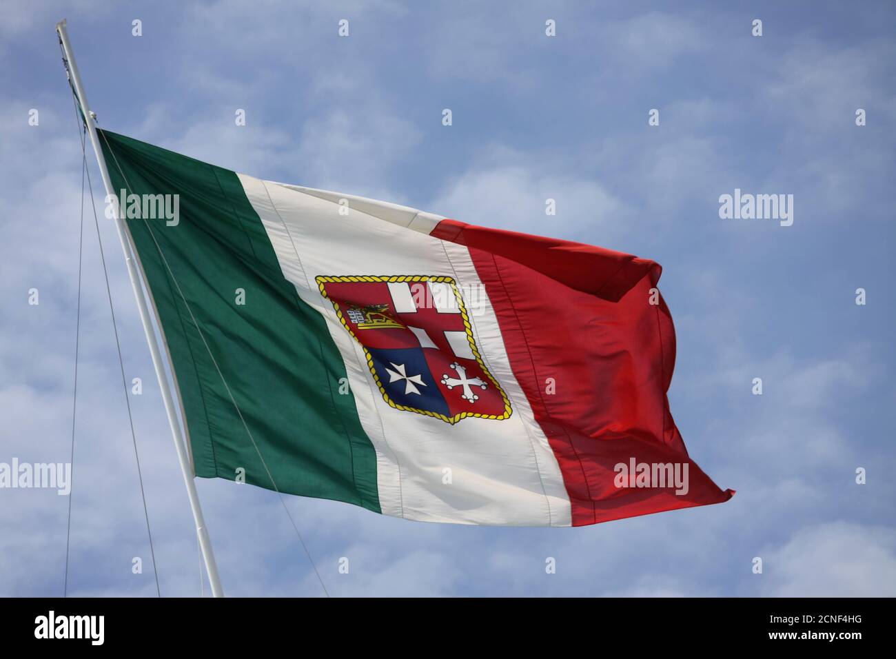 The Italian Civil Ensign flag. The shield depicts the four Maritime Republics: Venice, Genoa, Amalfi and Pisa Stock Photo
