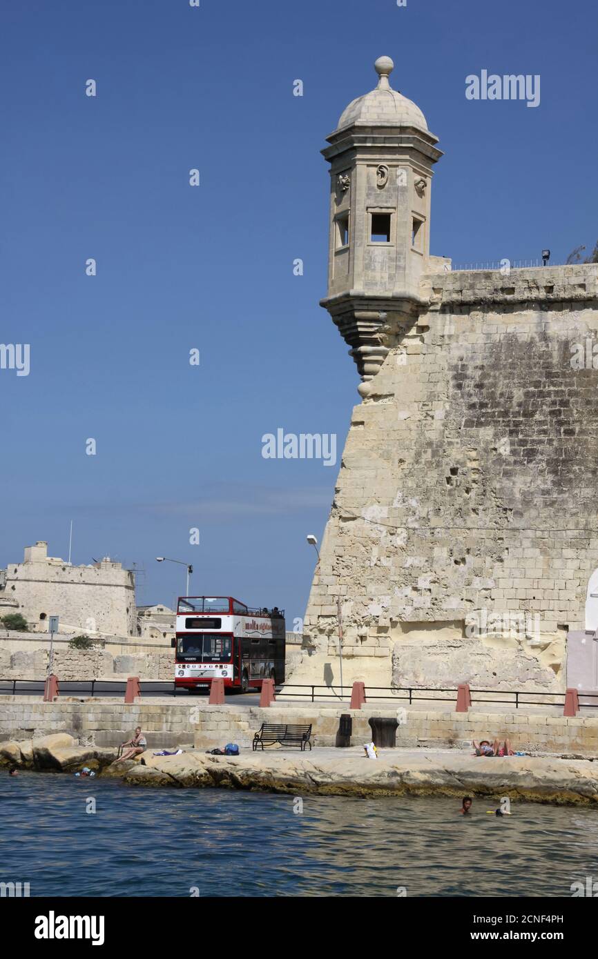 A medieval turret and battlements on Fort Ricasoli, a bastioned fort in Kalkara, Malta Stock Photo