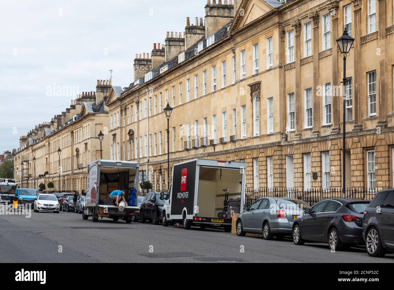 Removal vans in Great Pulteney Street, City of Bath, Somerset, England, UK Stock Photo