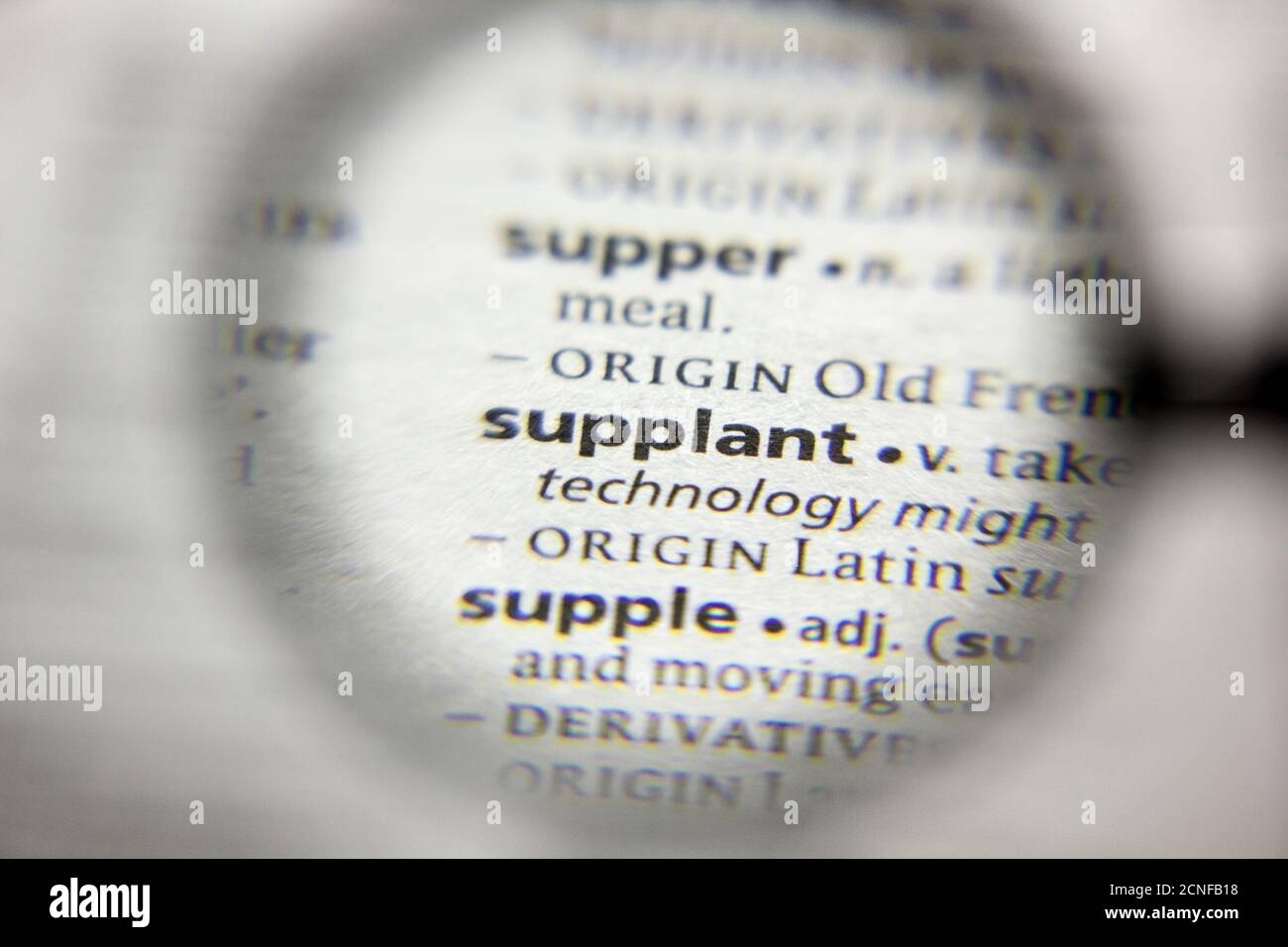 The word or phrase Supplant in a dictionary Stock Photo