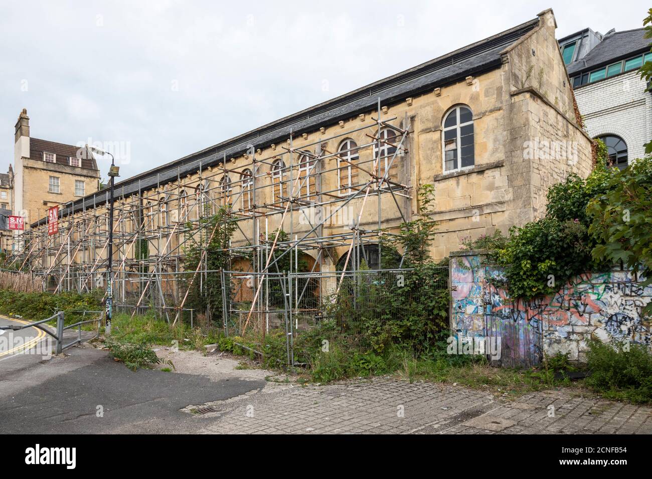 Scaffolding at The Cornmarket in Walcot Street, Bath. A derelict Grade