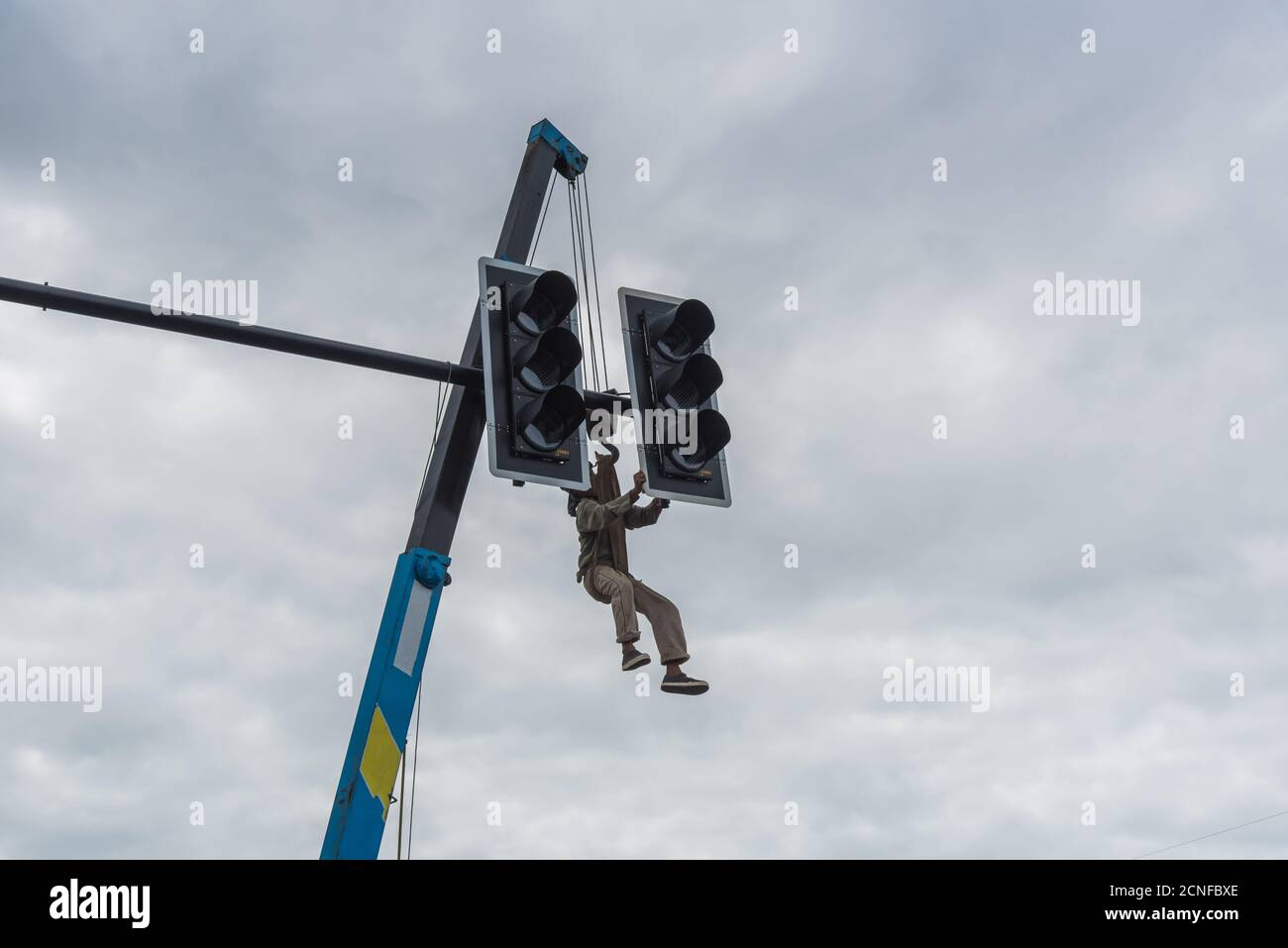 The repair team of electricians troubleshoots governing the traffic lights at the intersection. Stock Photo