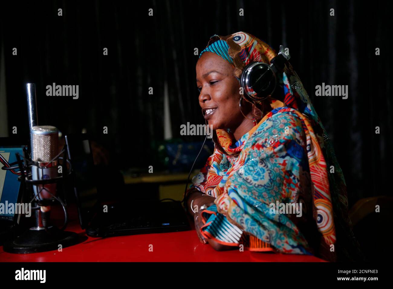 Presenter Halima Abba Ibrahim speaks into a microphone during a shortwave  broadcast for Dandal Kura at a radio station in Nigeria's northern region  of Kano, January 18, 2016. Dandal Kura, Kanuri for "
