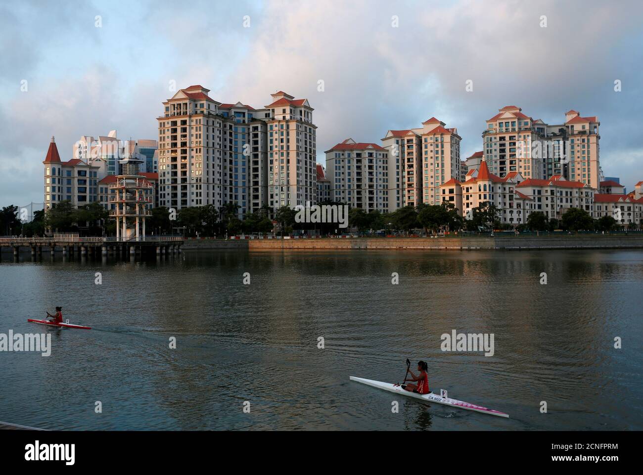 Kayakers pass private residential condominiums at Tanjong Rhu in Singapore August 18, 2016. REUTERS/Edgar Su/File Photo             GLOBAL BUSINESS WEEK AHEAD PACKAGE    SEARCH BUSINESS WEEK AHEAD 17 OCT FOR ALL IMAGES Stock Photo