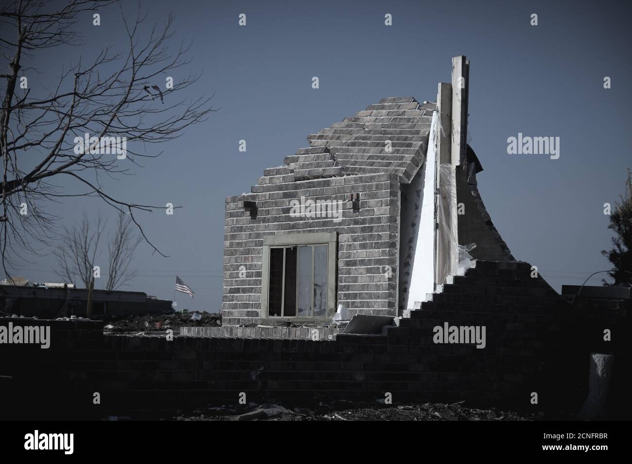 Fireplace left standing in a home destroyed by a tornado in Washington, IL Stock Photo
