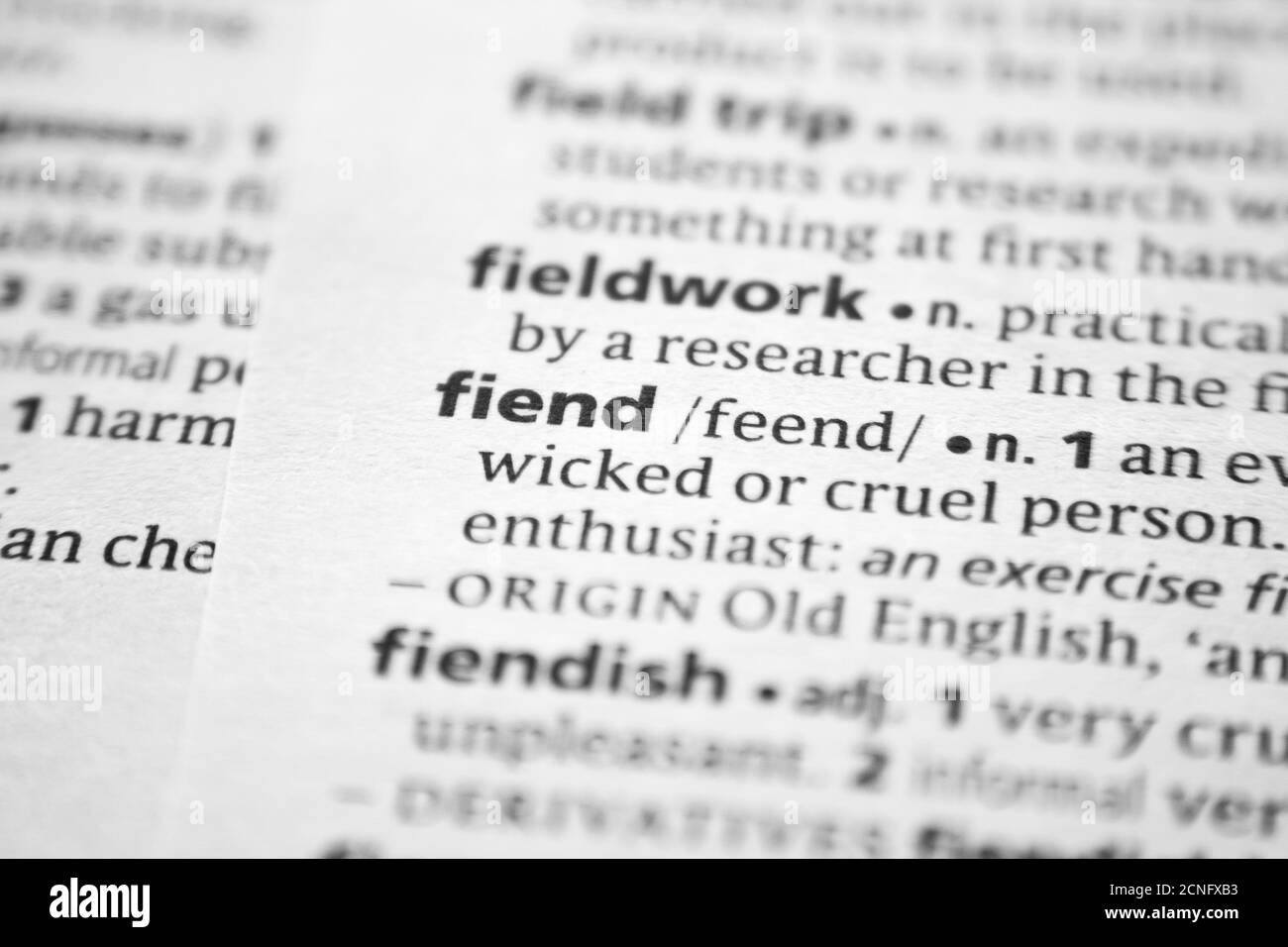 Word or phrase Fiend in a dictionary Stock Photo - Alamy