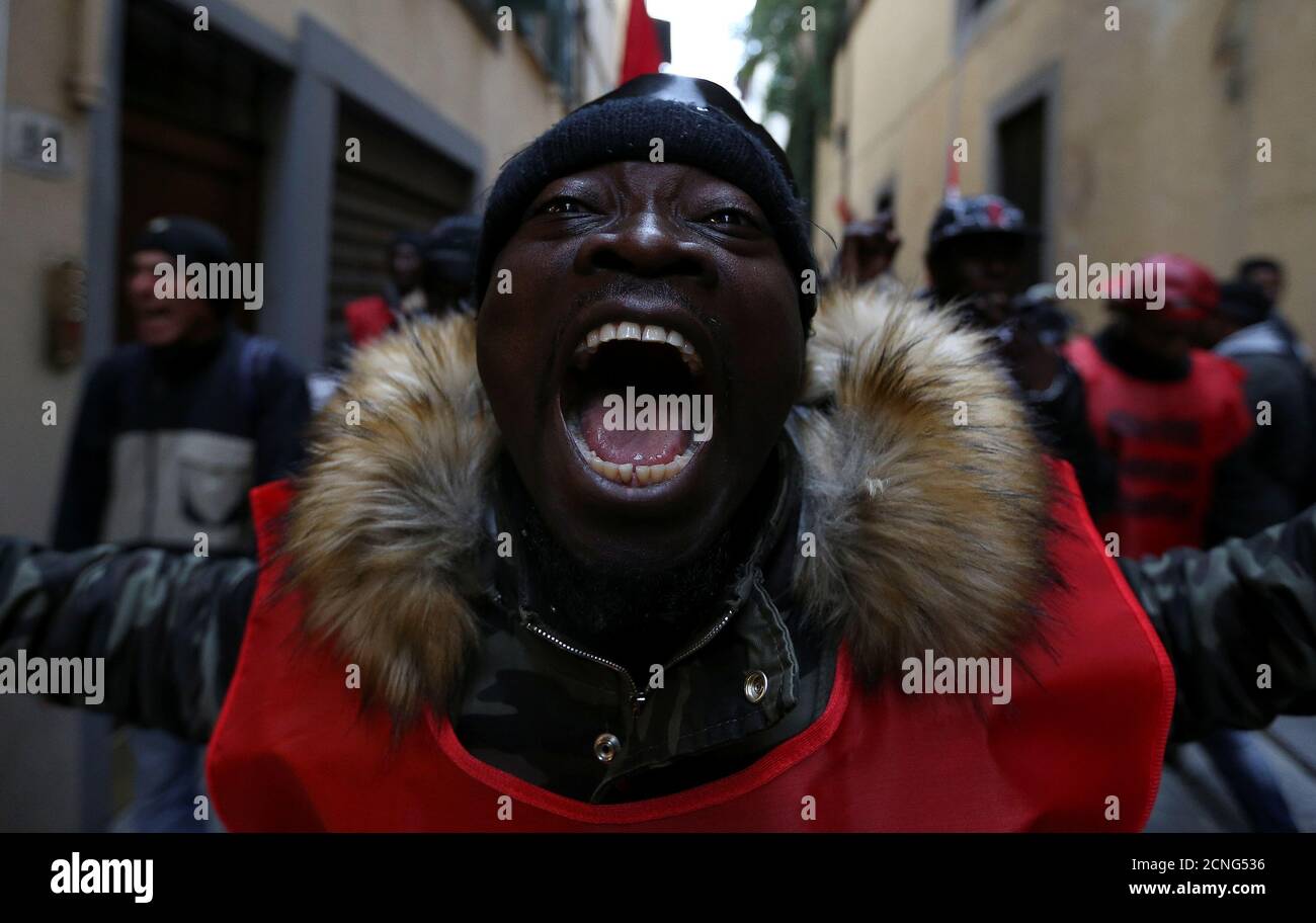A man attends a rally against racism and in support of Idy Diene, a Senegalese street vendor who was killed by an Italian, in Florence, Italy March 10, 2018. REUTERS/Alessandro Bianchi Stock Photo