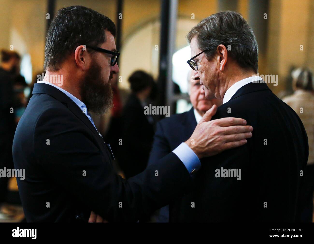 German former foreign minister Guido Westerwelle (R) chats with Kai Diekmann, chief editor of Bild newspaper, during a meeting in the Bundestag, the lower house of parliament, in Berlin December 17, 2013.      REUTERS/Thomas Peter (GERMANY  - Tags: POLITICS) Stock Photo